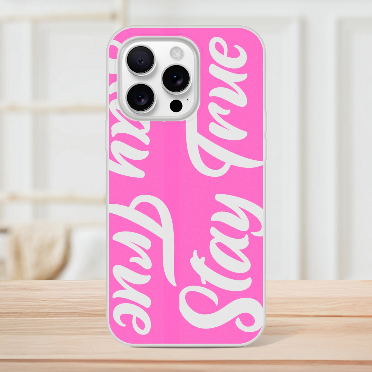 Pink Stay True iPhone case for iPhone 13–16 with bold streetwear slogan and protective design.
