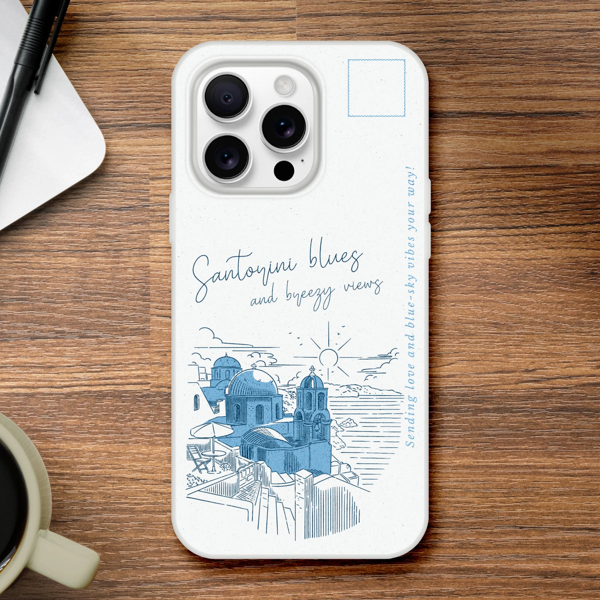 Vintage postcard-style iPhone case with Santorini blue-domed skyline on white matte shell.