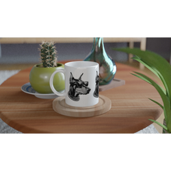 Gangster Dog Mug Gift For Him: white ceramic mug with a dog wearing sunglasses and a chain, on a wooden coaster.