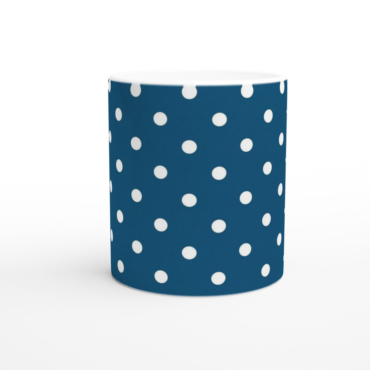 Navy blue ceramic mug featuring a retro white polka dot pattern, perfect for coffee or tea.