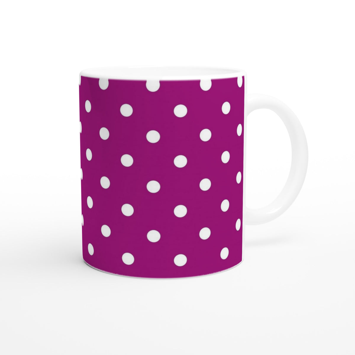 Purple and white polka dot ceramic mug with a retro spotty design, perfect for daily coffee or tea.