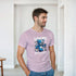 Male model wearing a pink teddy bear graphic tee with a blue bear and WANTED print, soft cotton blend.