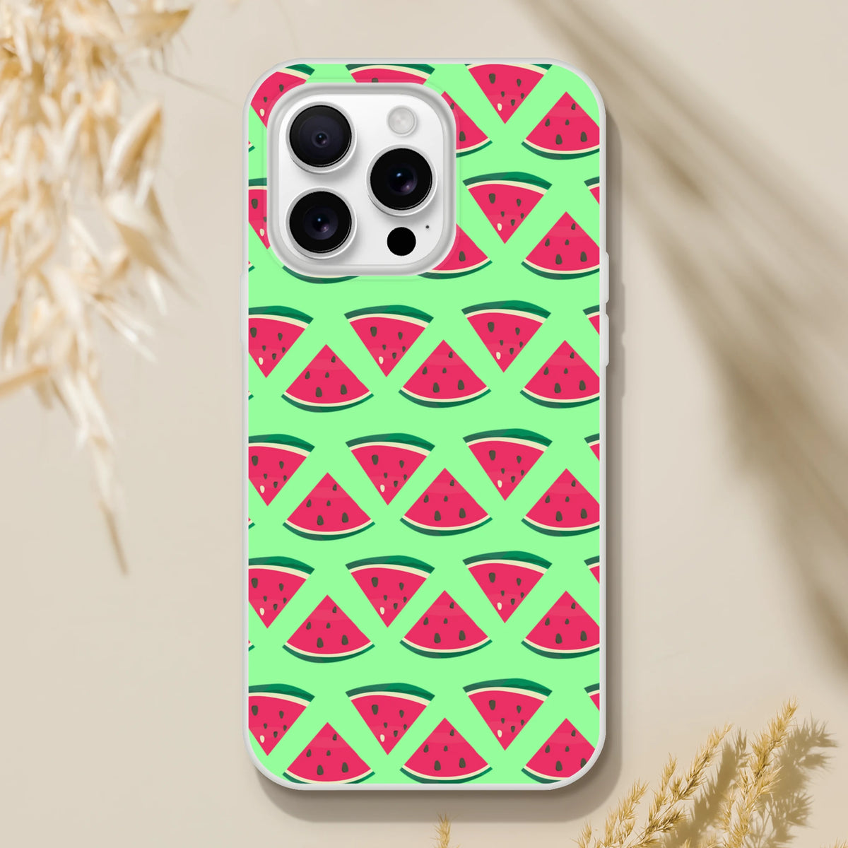 Cute watermelon pattern iPhone case on light green background. Summer fruit design phone cover compatible with iPhone 13-16.