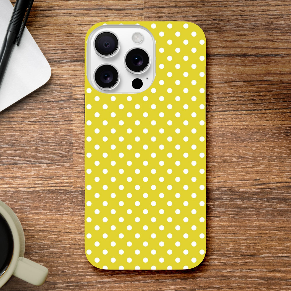 Yellow and white polka dot tough iPhone case for models 13-16. Vintage-inspired TPU design with impact absorption and precise button alignment.