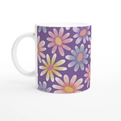 Retro pastel daisy mug with purple background, white handle, colorful floral pattern—ceramic coffee cup.