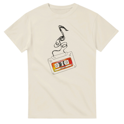 Cream t-shirt featuring a retro cassette tape illustration with unraveling black tape ribbon and colorful "90s Hits" label.
