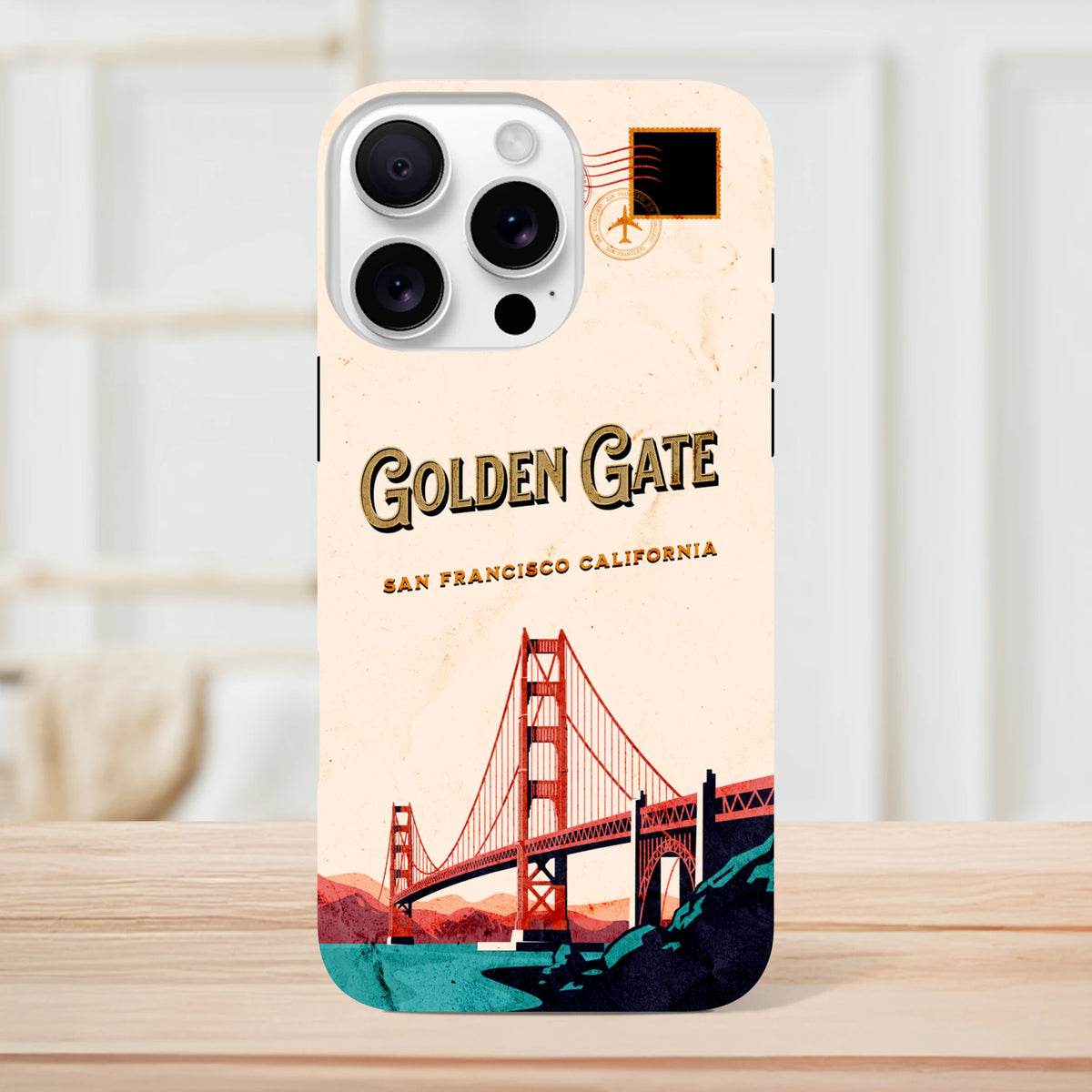 Retro San Francisco iPhone case featuring a vintage Golden Gate Bridge postcard design with travel stamp graphic.