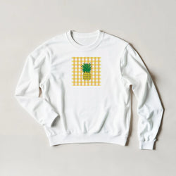 White crewneck sweatshirt featuring a retro yellow gingham square with a tropical pineapple graphic for a vintage streetwear look.