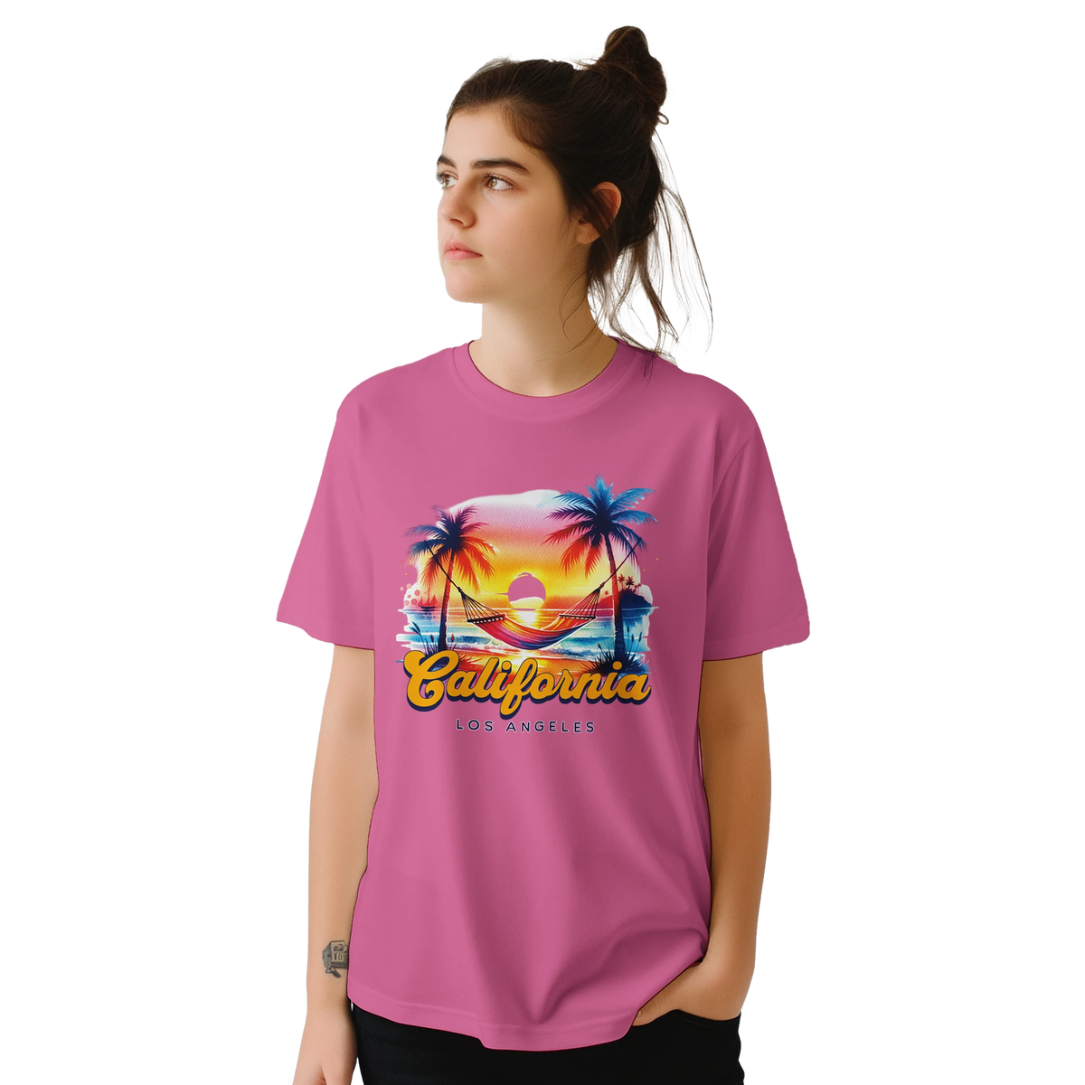 Young woman wearing pink retro California tee with palm trees and sunset graphic