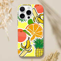Yellow iPhone case featuring bold orange, banana, and pineapple sticker graphics on a bright background.
