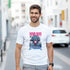 Man wearing white Monkey DJ graphic T-shirt on a city street, featuring a colorful monkey with headphones.