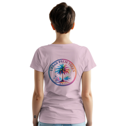 Back view of a woman wearing a pink vintage palm tree graphic T-shirt with a tropical circle design.
