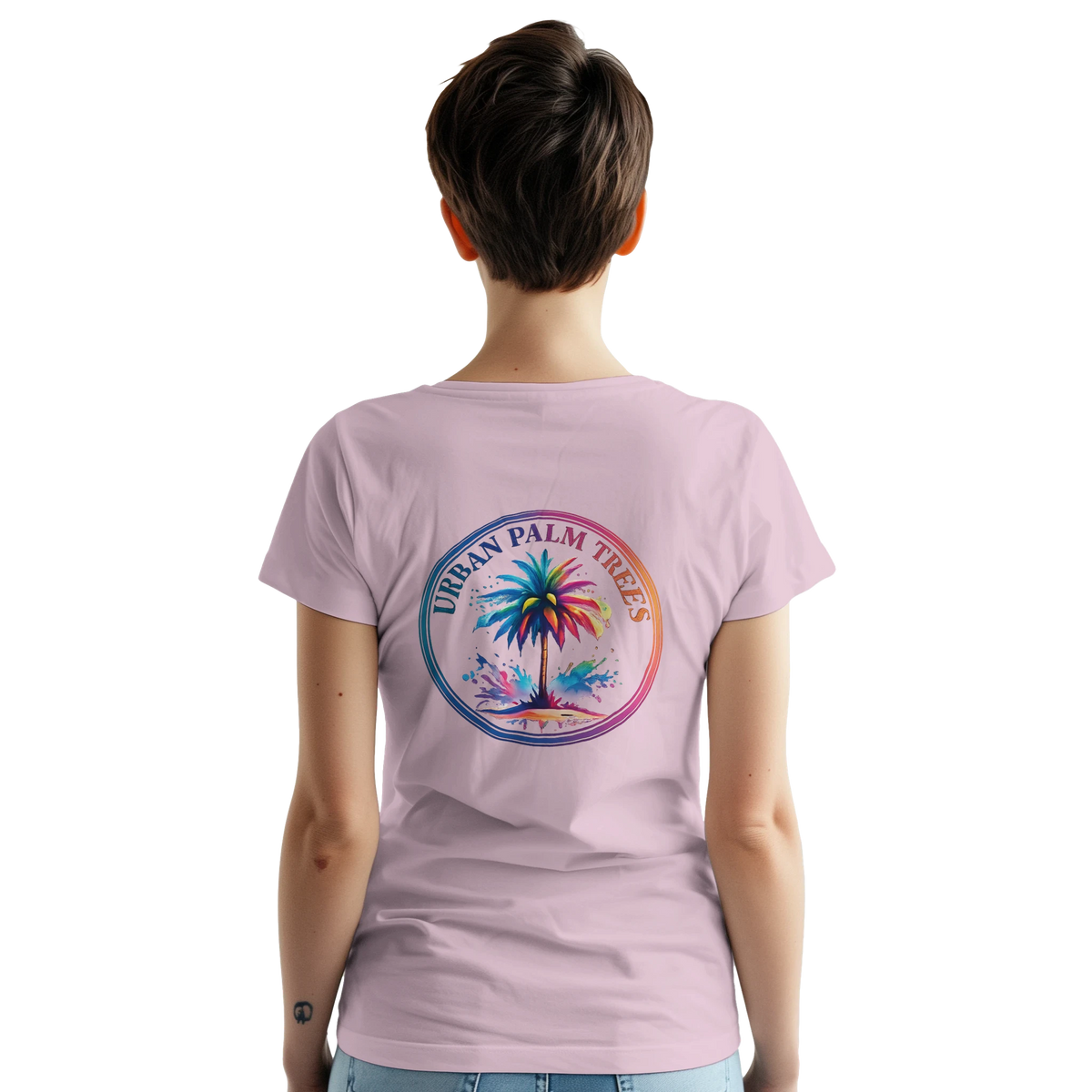 Back view of a woman wearing a pink vintage palm tree graphic T-shirt with a tropical circle design.