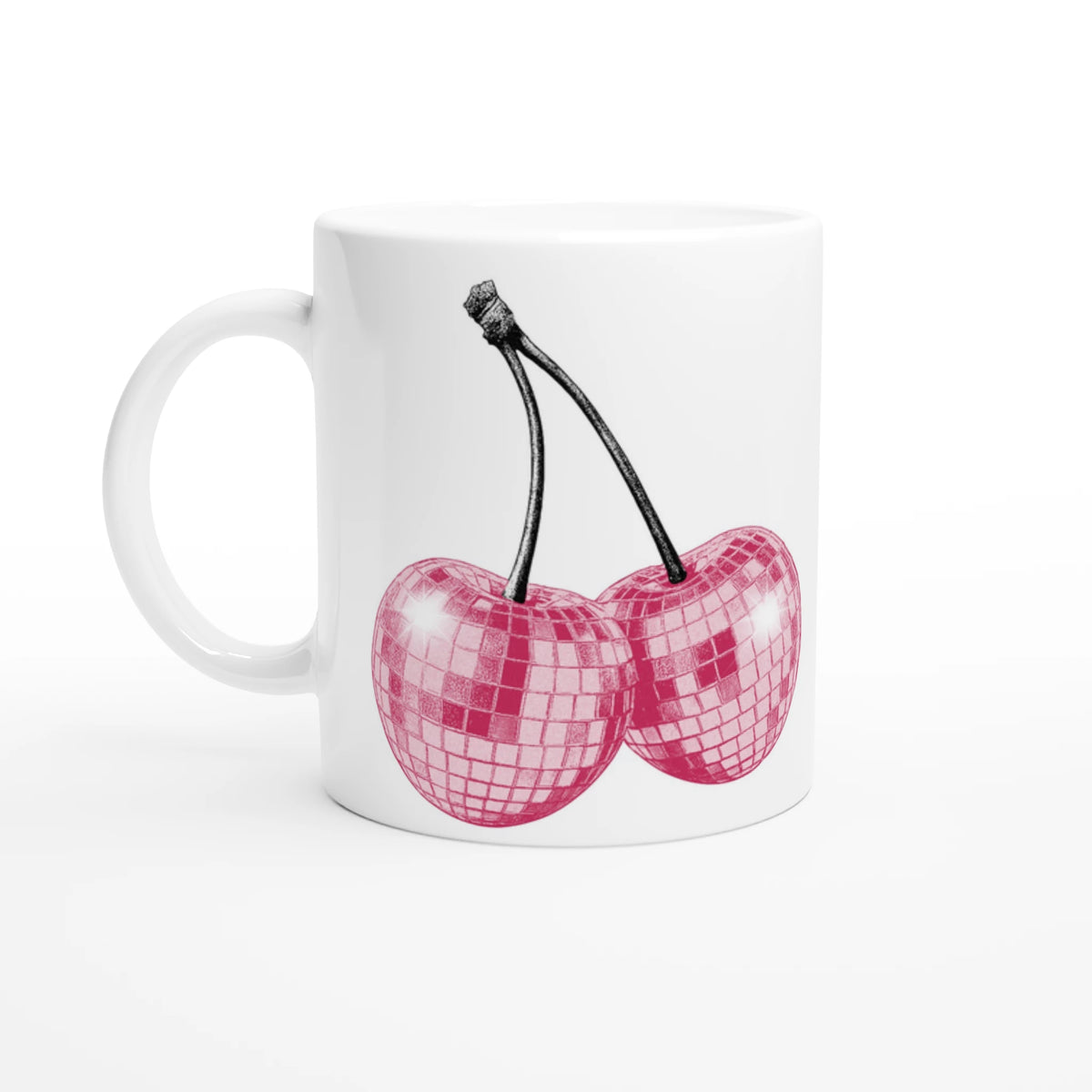 White coffee mug with retro glitter cherries design in pink, a playful desk accessory.