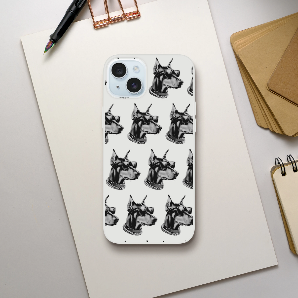 Clear iPhone case with repeating black-and-white gangster dog heads wearing sunglasses and chains.