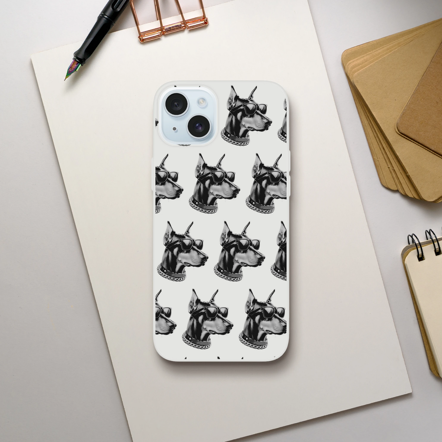 Clear iPhone case with repeating black-and-white gangster dog heads wearing sunglasses and chains.