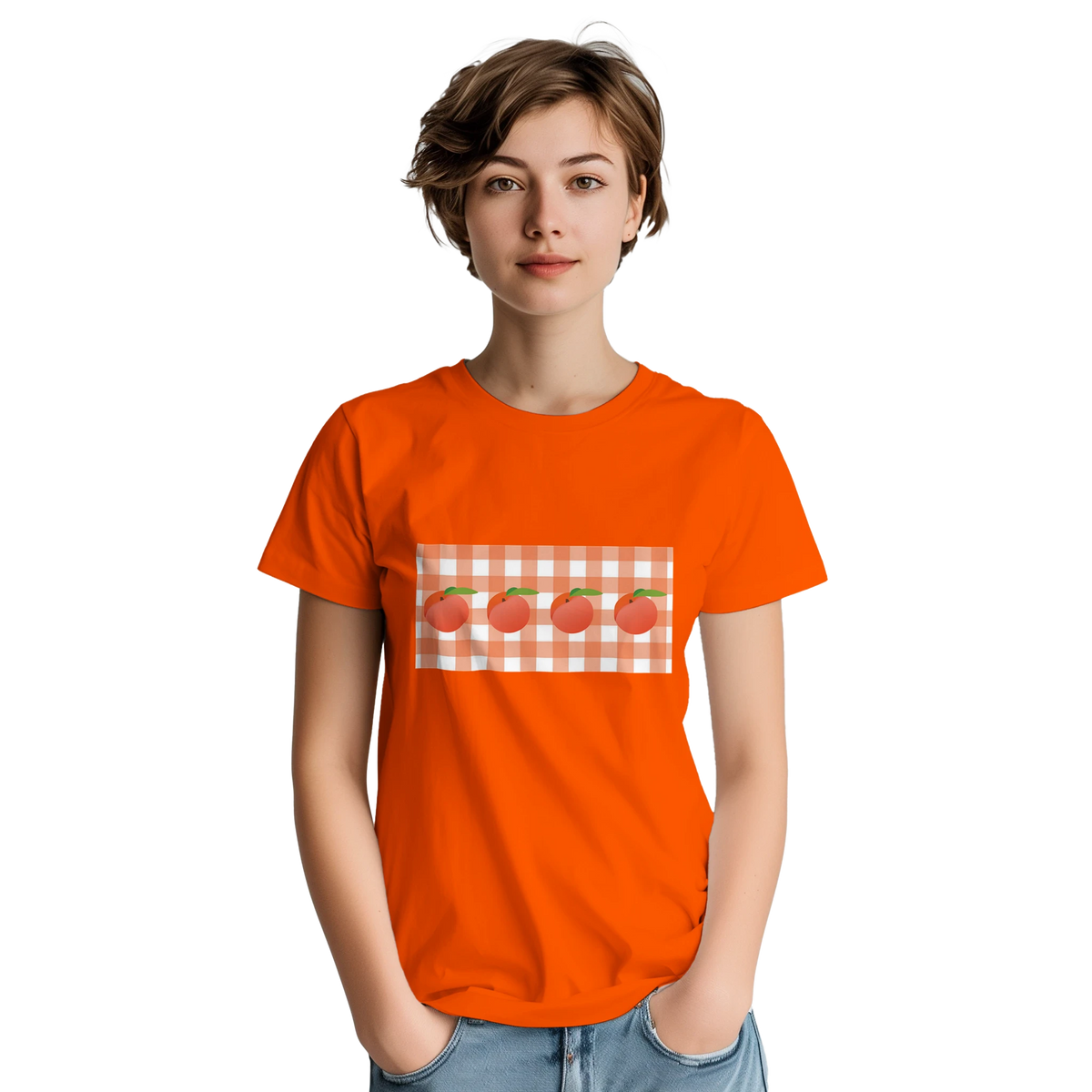 Woman wearing an orange graphic tee featuring peaches on a gingham patch.