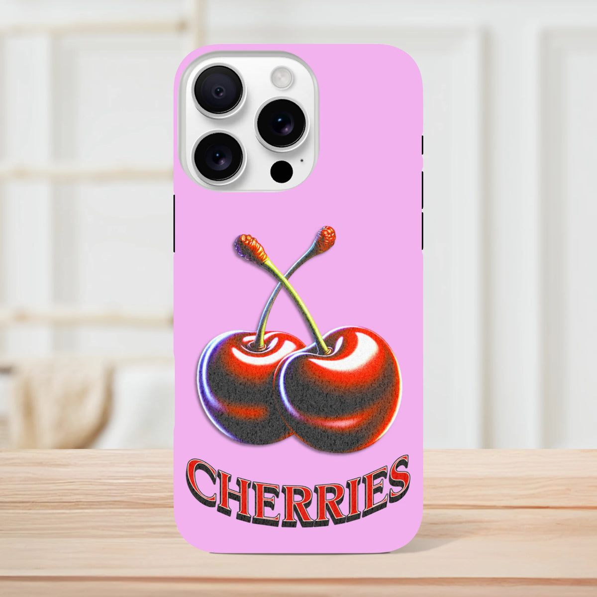 Pink iPhone case featuring retro glossy red cherries and "CHERRIES" text in a cute Y2K style design.