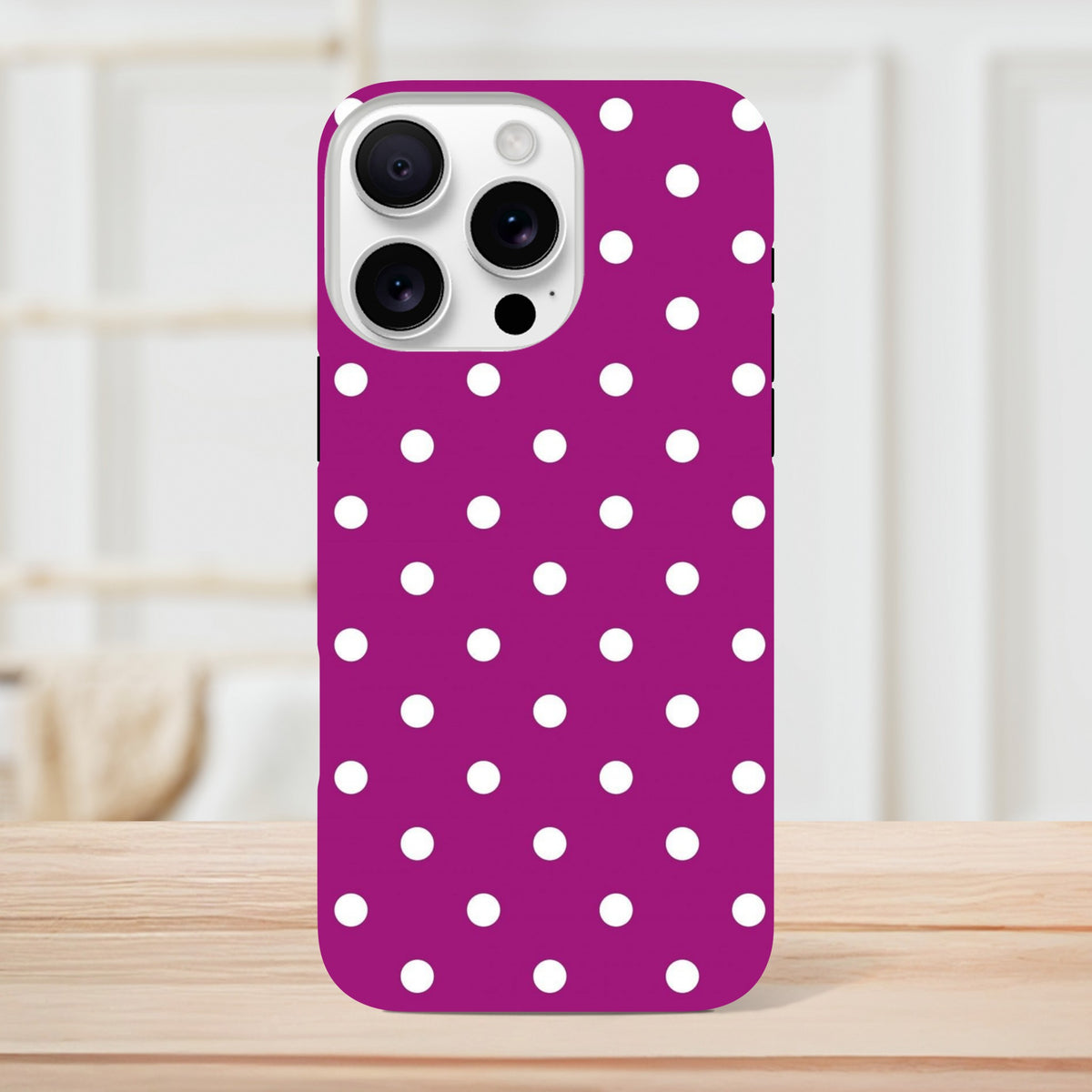 Purple and white polka dot tough iPhone case offering playful aesthetics and rugged dual-layer TPU defense for iPhone 13-16.