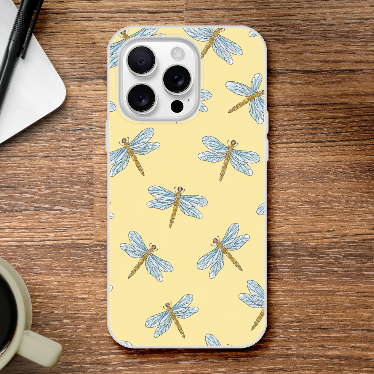 Yellow iPhone case (13-16) with blue dragonfly pattern on pale yellow background and triple-camera cutout