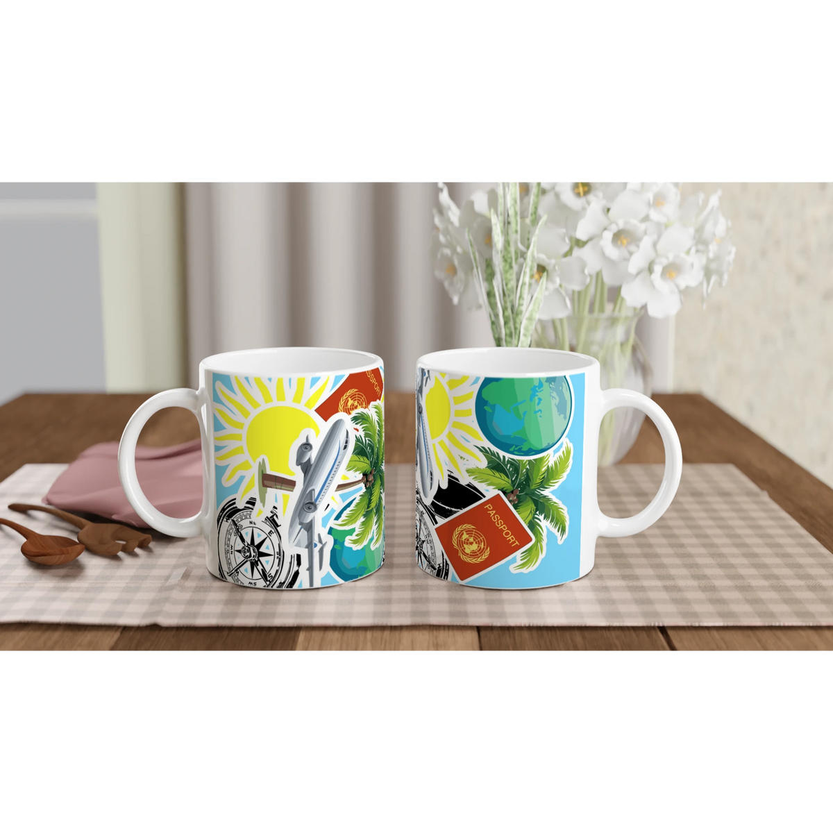 White ceramic travel mugs featuring colorful illustrations of a passport, compass, airplane, and tropical palm leaves on a wooden table.