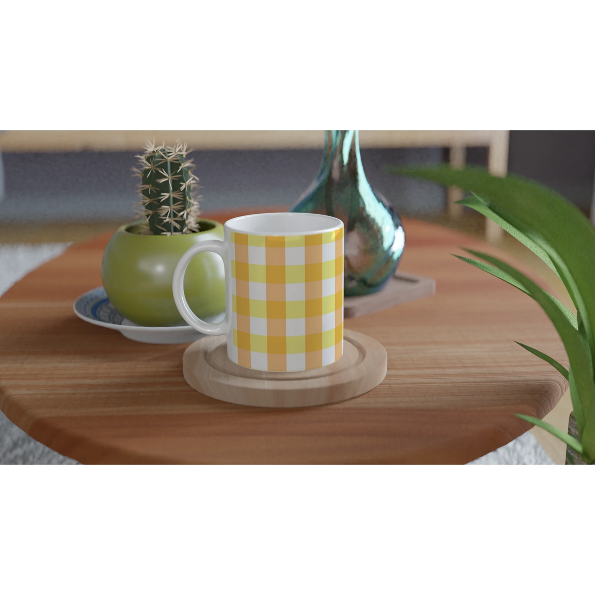 Yellow gingham ceramic mug with a checkered pattern on a wooden table, beside a cactus and green vase.