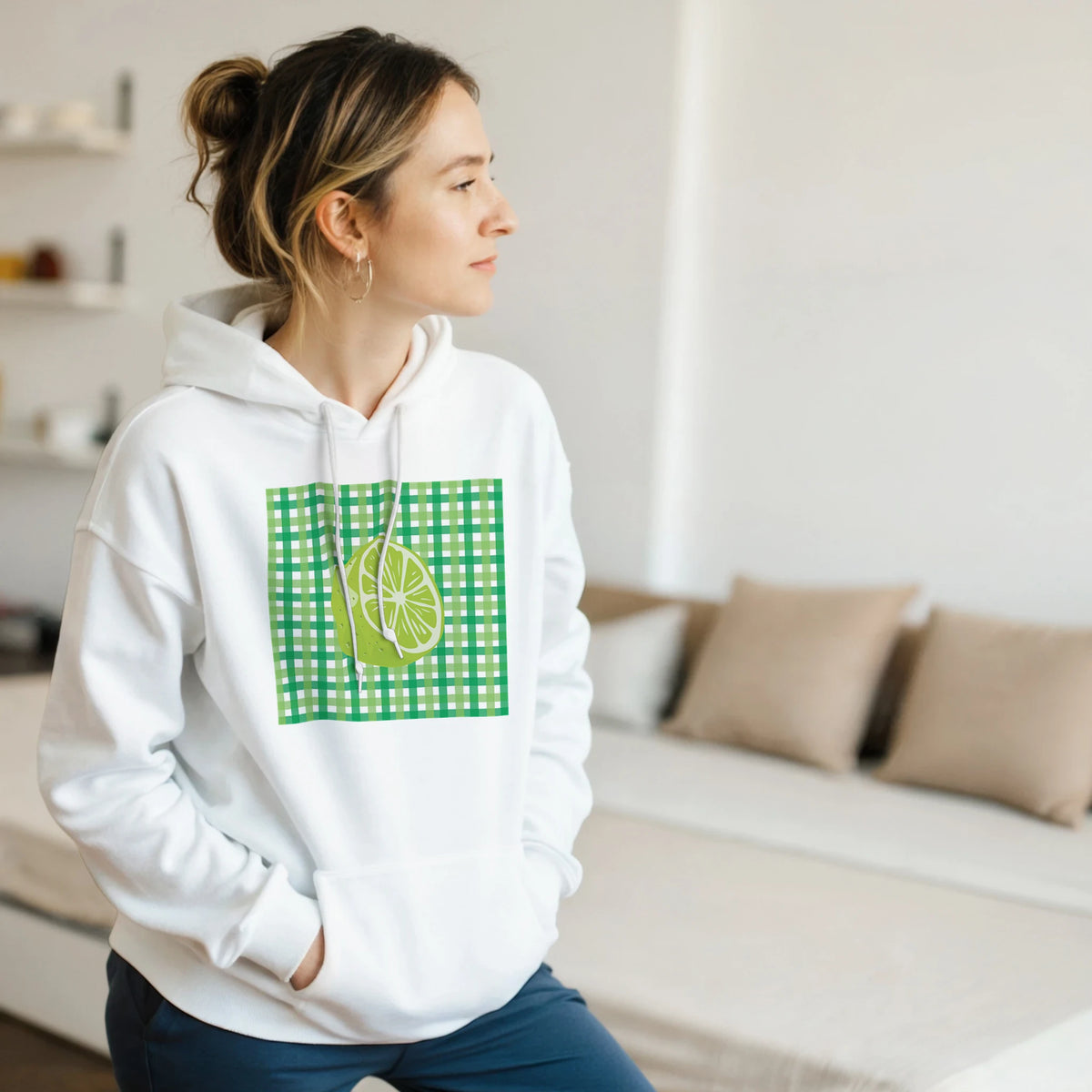 White pullover hoodie featuring a retro green gingham square graphic with a vintage lime slice illustration on the front.