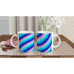 Two rainbow-striped ceramic mugs with blue, pink, and turquoise swirls on a table.