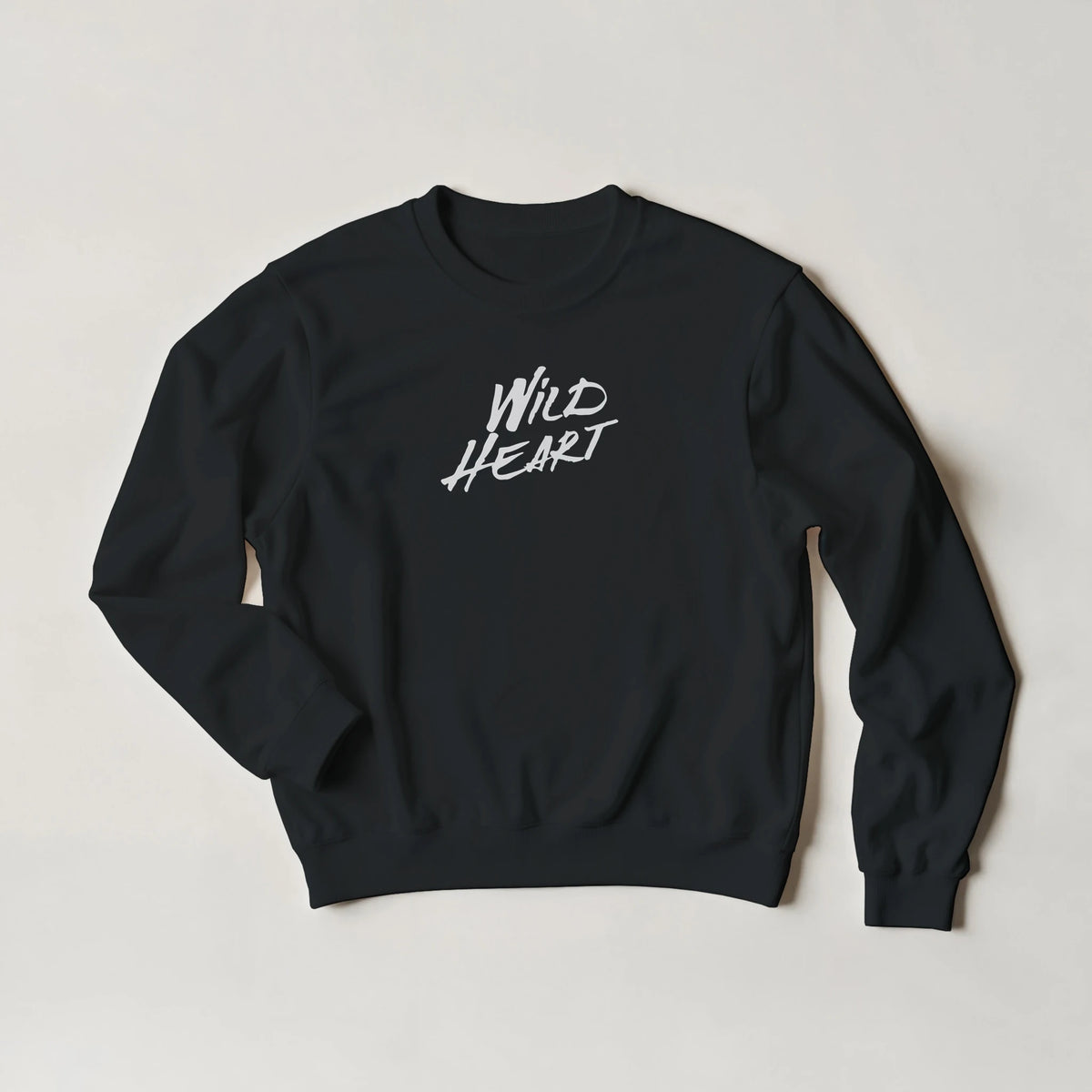 Black women's sweatshirt with white "Wild Heart" slogan, cozy streetwear top.