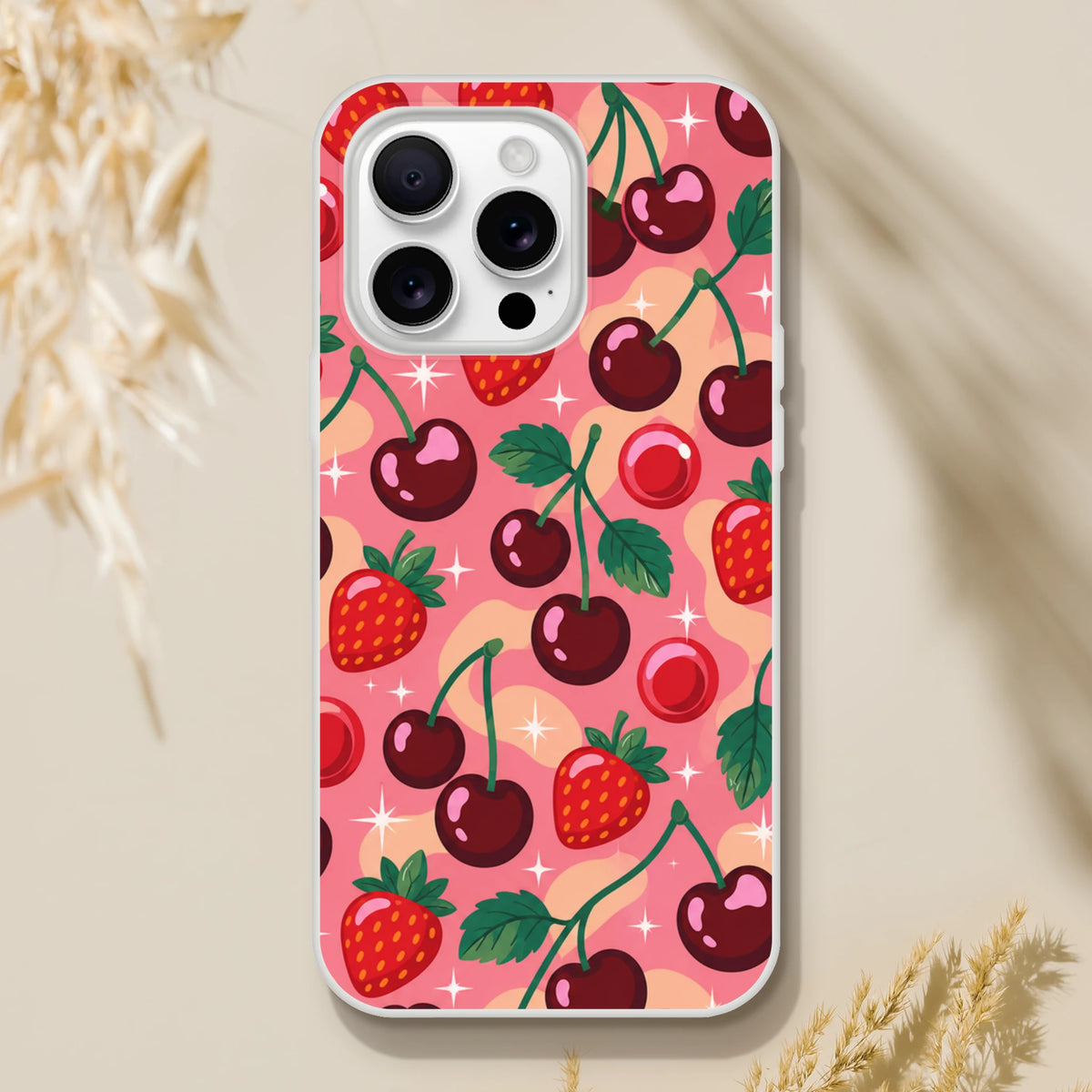 Retro pink iPhone case featuring a retro cherry and strawberry fruit pattern with sparkles, designed for iPhone 13-16 models.