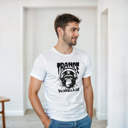 Man wearing white Trance DJ Monkey graphic tee featuring gorilla with headphones and "Gorilla" text for rave music lovers.