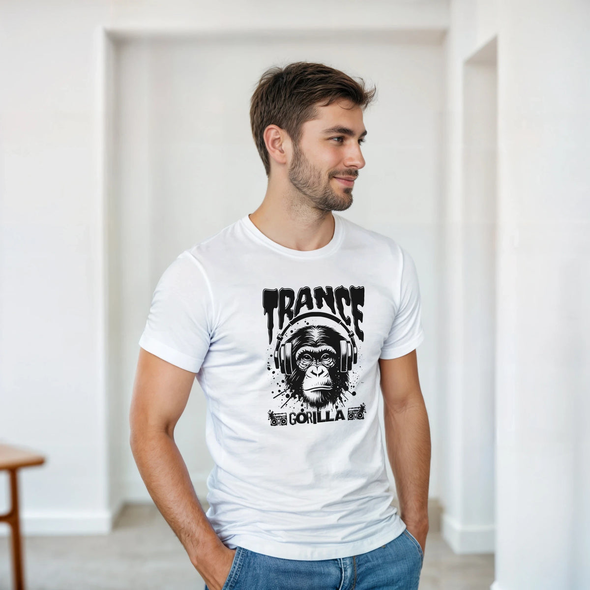 Man wearing white Trance DJ Monkey graphic tee featuring gorilla with headphones and "Gorilla" text for rave music lovers.