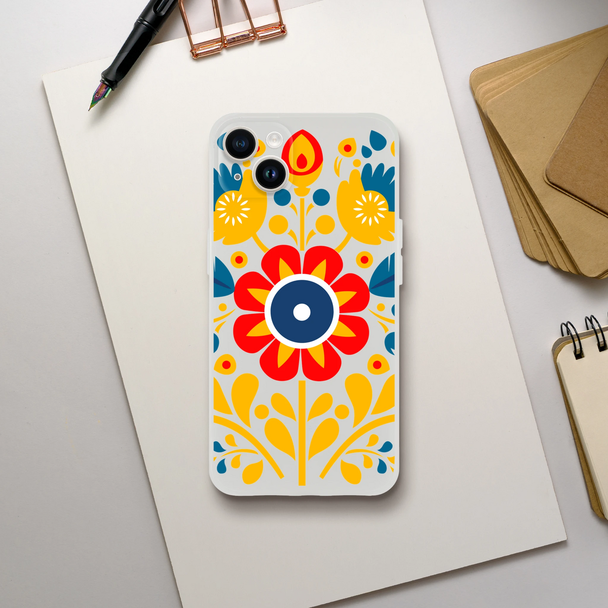 Floral slim protective clear case for iPhone 13-16; bright yellow, red and blue pattern.
