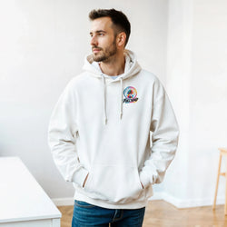 Man wearing cream petrolhead streetwear hoodie with colorful palm tree logo, styled with jeans for a casual car-culture look.