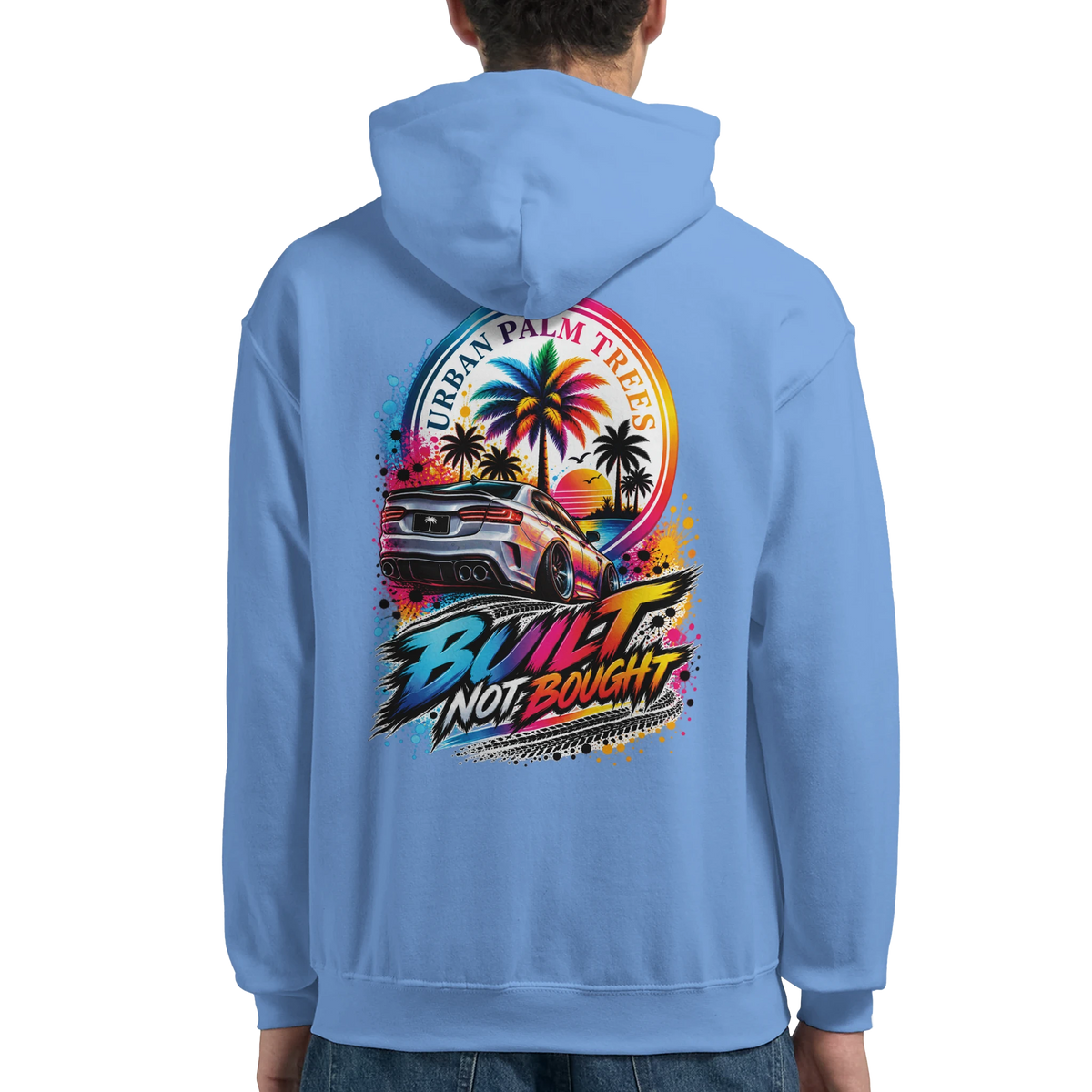Blue petrolhead hoodie featuring "Built Not Bought" graphic with a modified car, palm trees, and sunset design on the back.