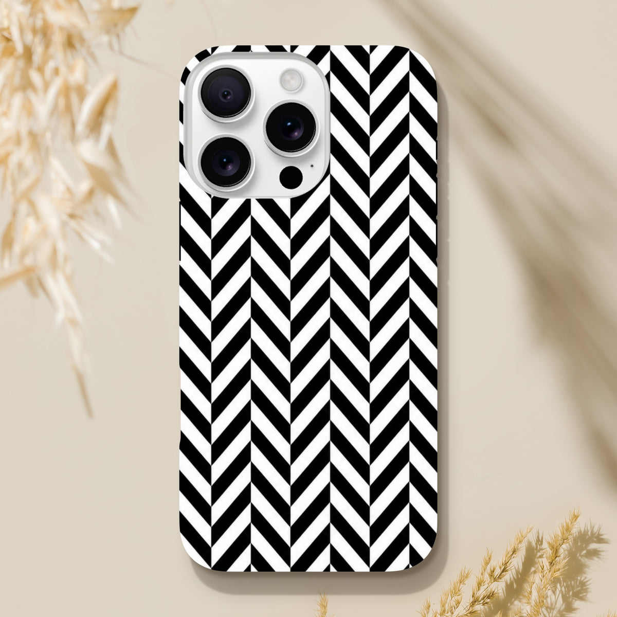 Black and white herringbone geometric iPhone case with tough shock-absorbing shell for models 13-16.