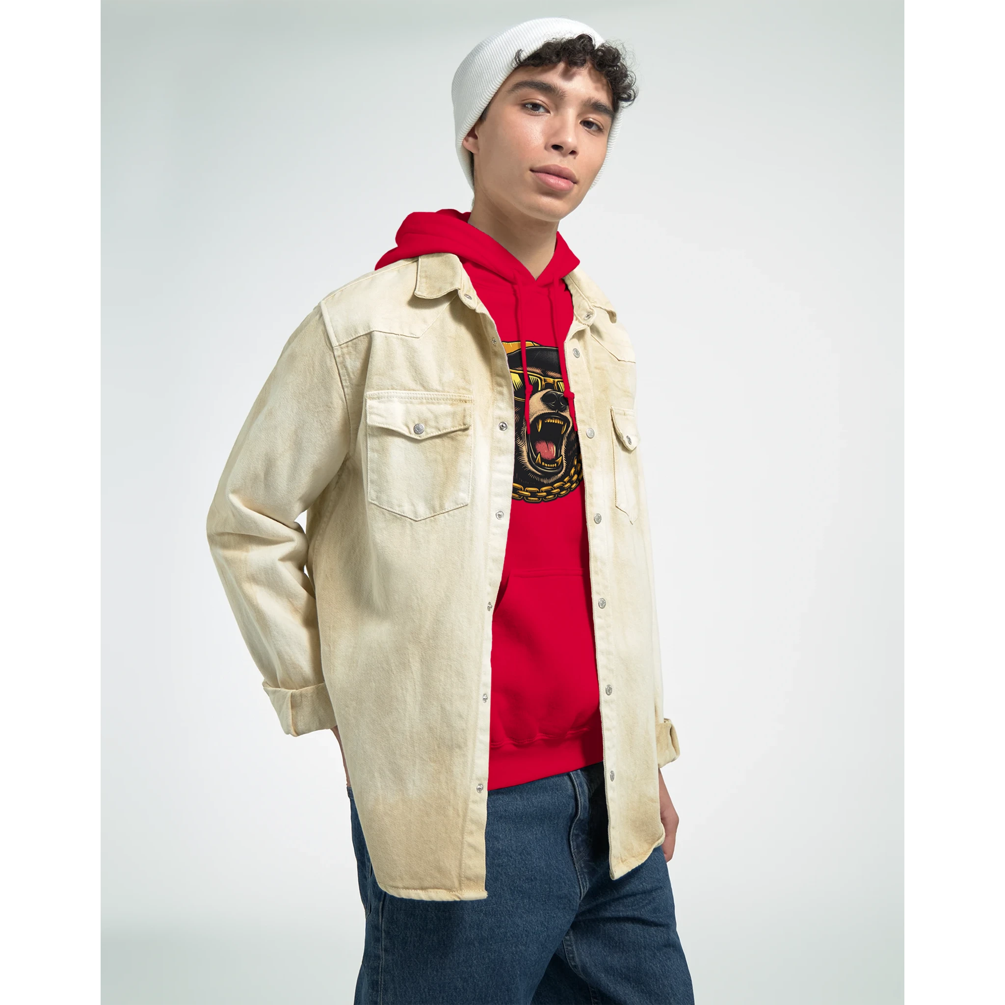 Man wearing Men's Grizzly Bear Hoodie in red over beige denim jacket with white beanie, studio portrait.