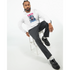 Man wearing Monkey DJ men's graphic hoodie in white with multicolor print; cotton blend.