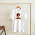 White Lips graphic tee with lips, finger over lips, and SHUT UP text on front.