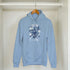Light blue cotton-poly hoodie with 'It's OK Not To Be OK' graphic and floral artwork, front pouch pocket.
