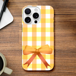 Yellow gingham iPhone case with a 3D orange bow featuring a vintage grid pattern for cute coquette street style.