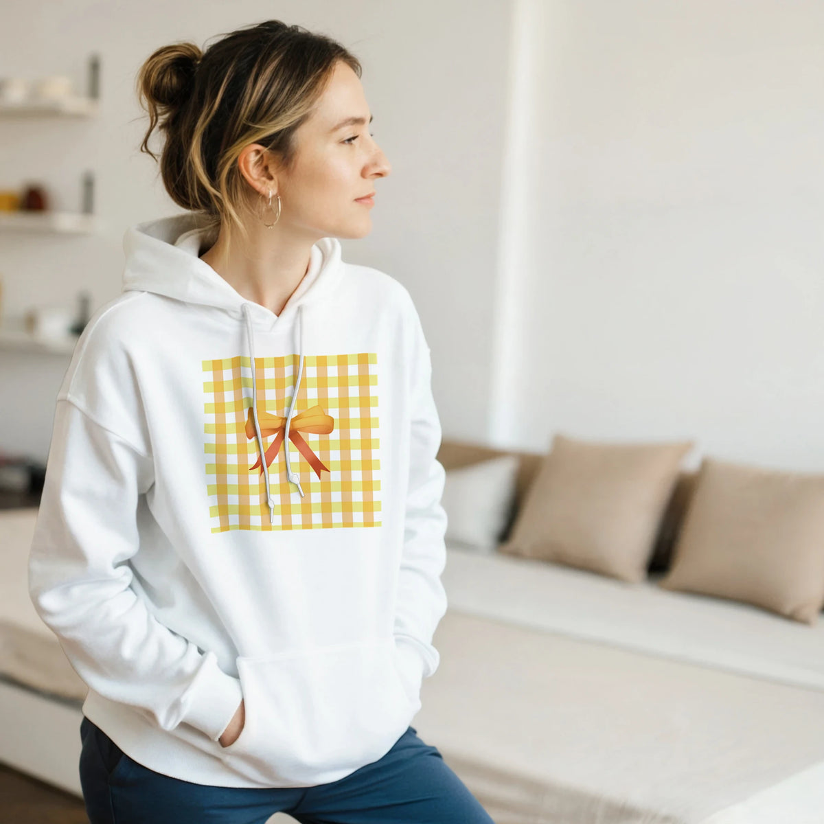 White hoodie with a yellow gingham bow print, embodying a cute coquette aesthetic jumper.