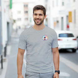 Man wearing grey crew neck tee with colorful Urban Palm Trees circular graphic on chest. Retro music style shirt.