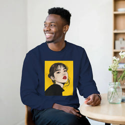 Man wearing navy sweatshirt featuring yellow Pop Art Woman portrait graphic, streetwear jumper with stylish female illustration.