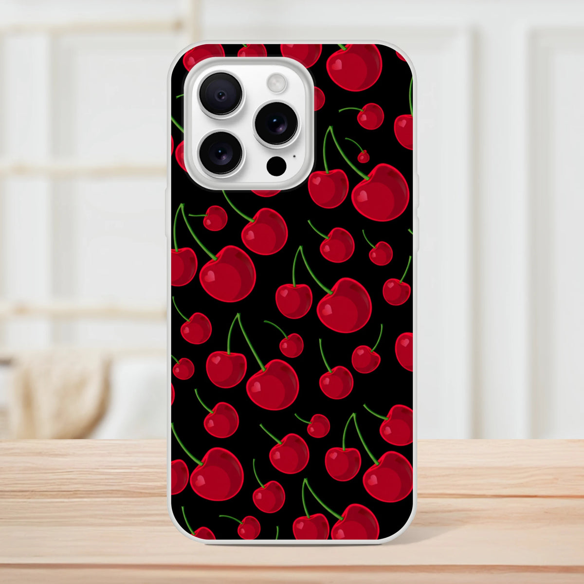 Black iPhone case featuring a retro red cherry pattern with green stems. Slim, matte TPU cover for shock absorption and vintage streetwear style.