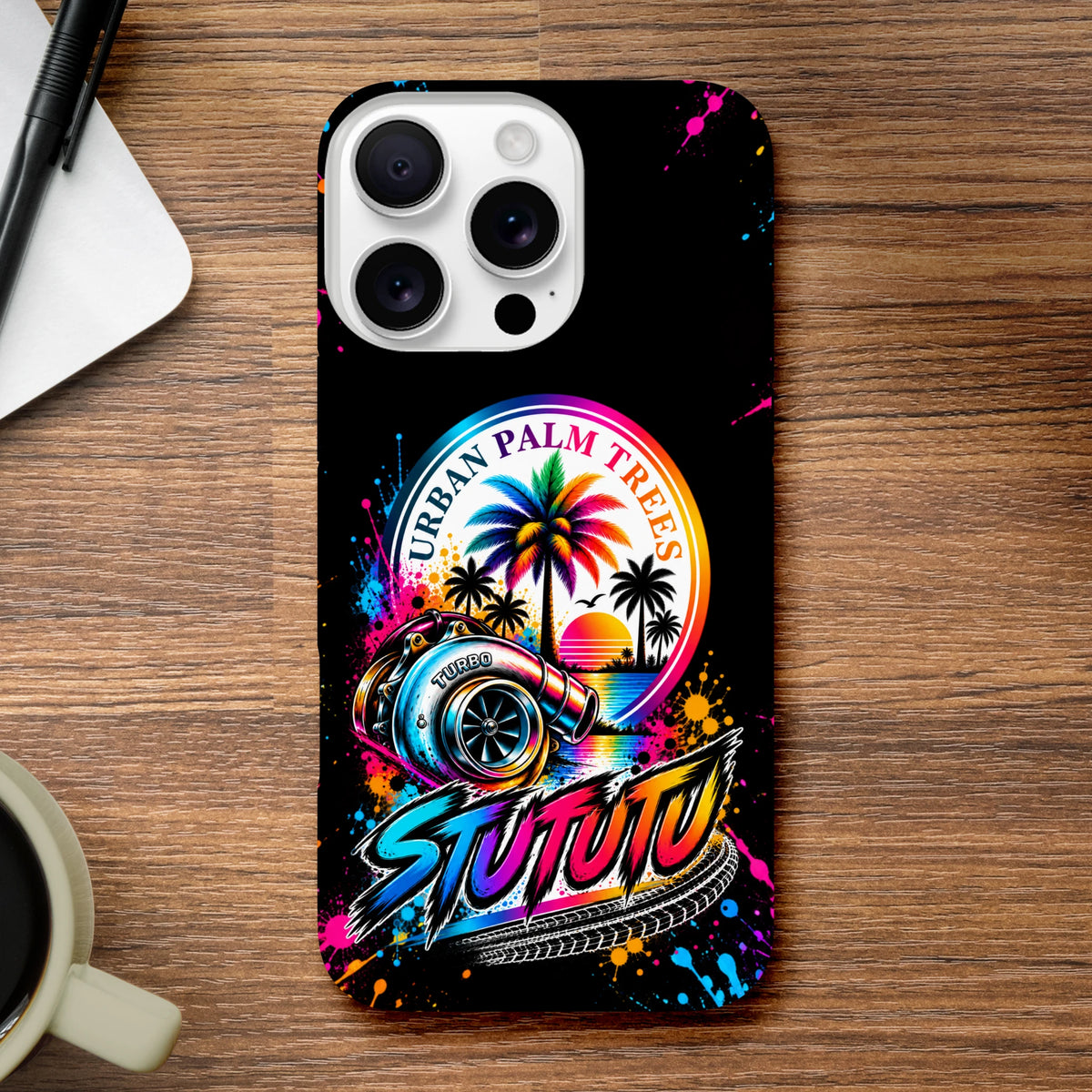 Black iPhone case featuring colorful turbocharger, rainbow palm tree sunset graphic, and stylized "STUTUTU" text with paint splatters.