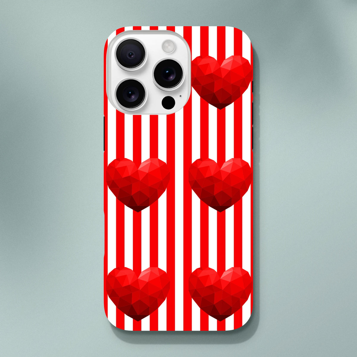 Retro iPhone case with red and white vertical stripes and geometric low-poly red heart graphics.