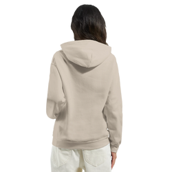 Woman wearing a beige Cute Believe In Yourself hoodie, cozy slogan top for women.