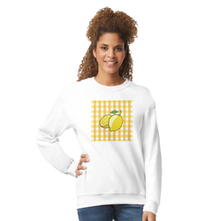 Woman wearing white sweatshirt with a yellow gingham square lemon graphic on the front.