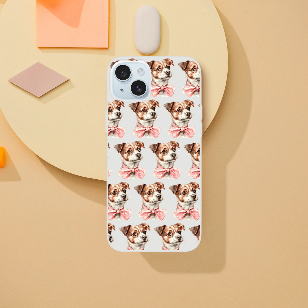 Slim clear iPhone case for 13-16 with a repeating pattern of brown-and-white dogs wearing pink bows.